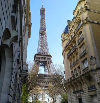 Vertical low angle shot of the Eiffel Tower against the blue sky. Paris, France. Stock Photos