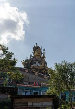 Vertical low angle shot of giant Padmasambhava (Guru Rinpoche) statue. Stock Photos