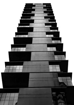 A vertical low angle shot of a high-rise building with modern design isolated Stock Photos