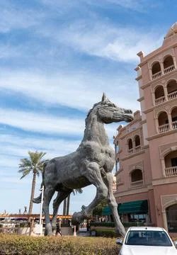 Vertical low angle shot of a horse statue at Marsa Malaz Kempinski in The Pearl. Stock Photos