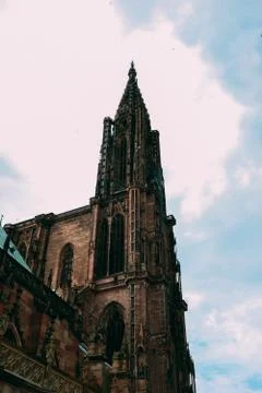 Vertical low angle shot of Notre Dame Cathedral captured in Strasbourg, Franc Photos