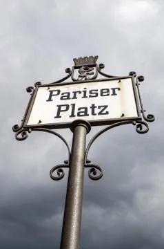 Vertical low angle shot of the Pariser Platz sign in Berlin Germany Stock Photos