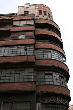 Vertical low angle shot of a rounded brick building in Bilbao, Spain Fotos de archivo