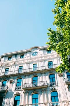A vertical low angle shot of a white concrete building with beautiful pattern Stock Photos