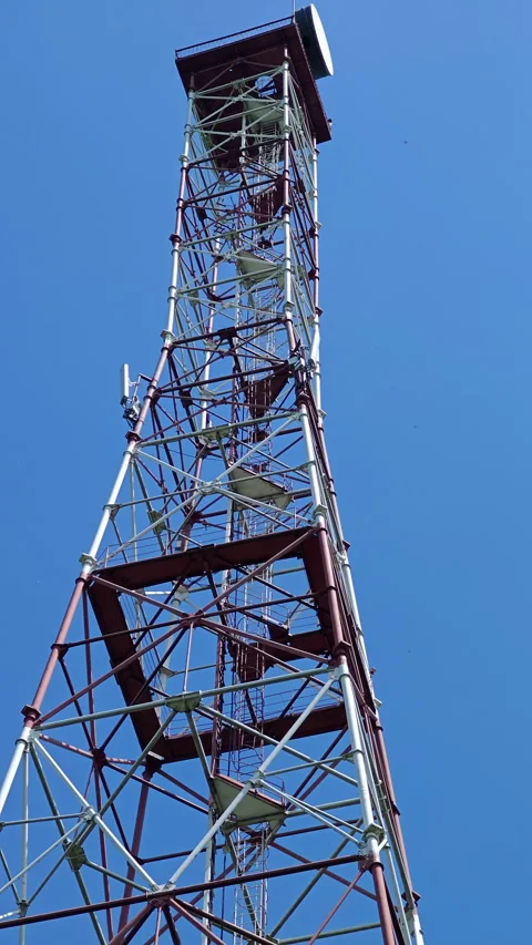 Vertical low angle view of 75m decommissioned military radar tower Video stock 337953400