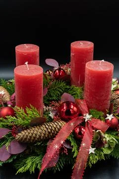 Vertical low angle view of beautiful new advent wreath with four red candle o Stock Photos