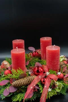 Vertical low angle view of beautiful new advent wreath with four red candle o Stock Photos