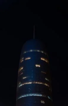 Vertical low-angle view of Burj Doha (Doha Tower) illuminated at night, Qatar Stock-Fotos