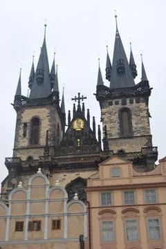 Vertical low-angle view of the Church of Our Lady before Tyn against the white s Fotos de archivo