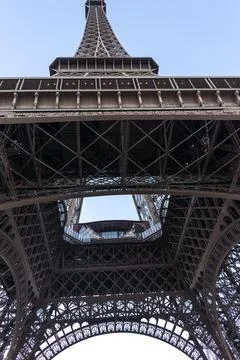 Vertical low angle view of the Eiffel Tower's steel beams in Paris, France Stock Photos