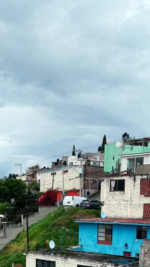 Vertical low drone flight over Toluca rooftops, Mexico 動画素材 348587952