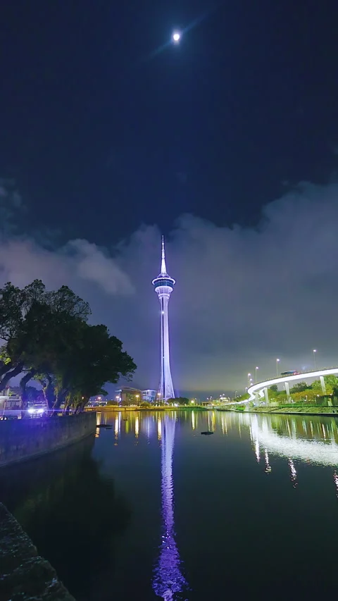Vertical Macau Tower Under the Moon with Water Reflections Stock Footage 344371535