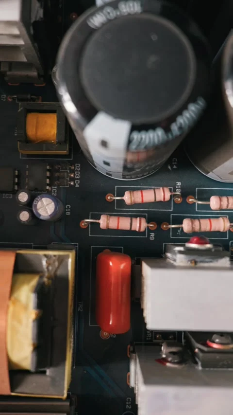 Vertical Macro Close Up of Printed Circuit Board Resistors and Capacitors Stock Footage 334109474