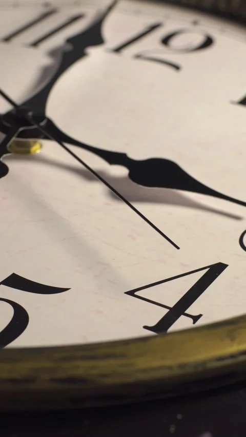 Vertical macro close up of vintage analog clock face with moving ticking hands Stock Footage 336090003