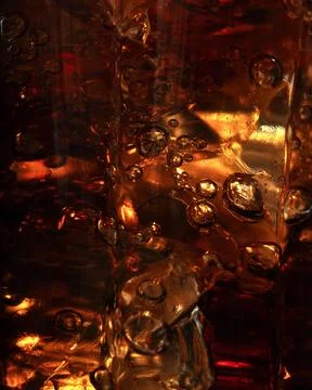 Vertical macro ice cubes in sparkling liquid 写真素材