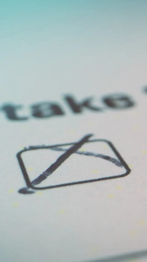 Vertical macro image of a document marked with a cross, conveying rejection, Stock Footage 328699228