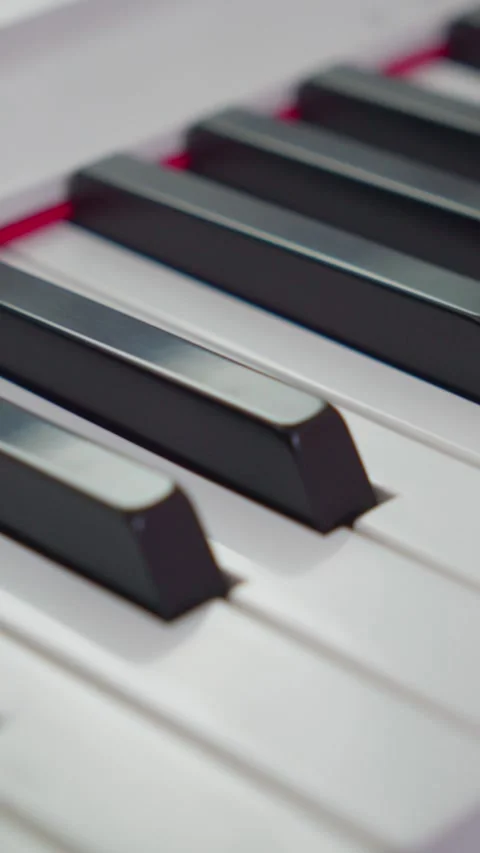 Vertical Macro Pan Down Piano Keys Close Up 4K Video stock 338368426