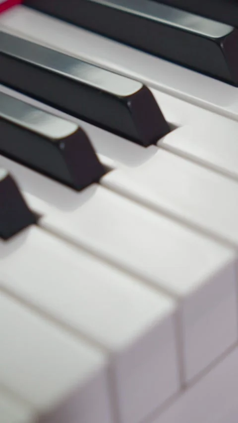 Vertical Macro Pan Up Piano Keys Close Up 4K Video stock 338368431