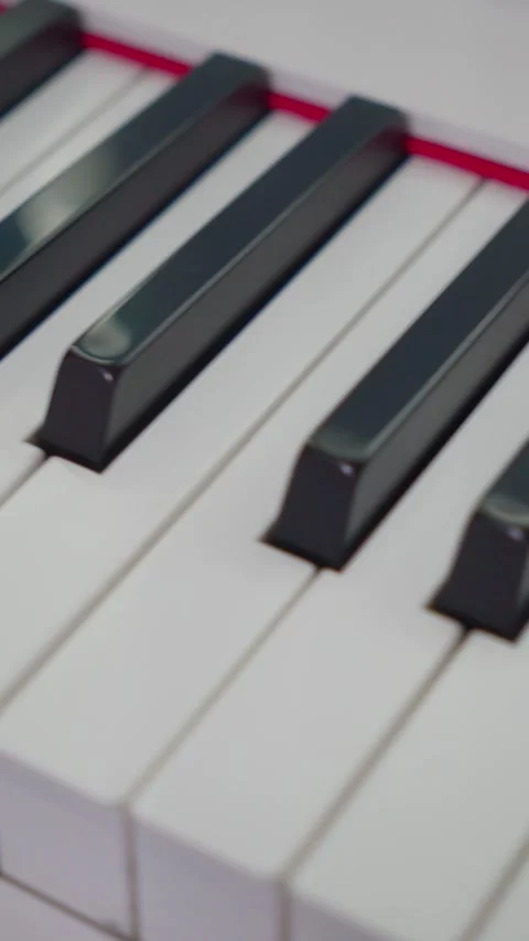 Vertical Macro Pan Up Piano Keys Close Up 4K Video stock 338368437