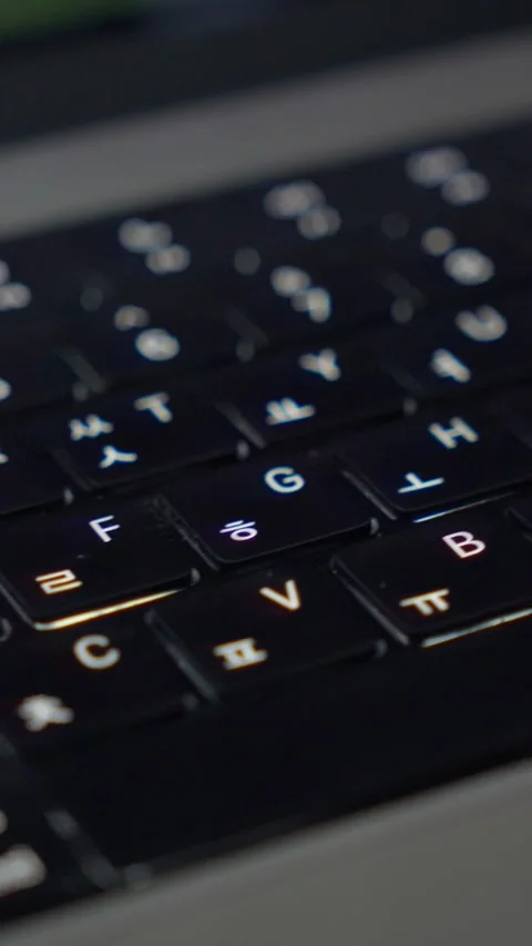 Vertical Macro Pan Right to Left Over Korean Laptop Keyboard 9:16 Video stock 338368533