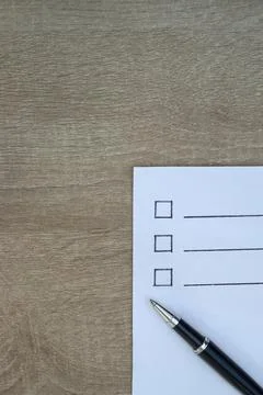 Vertical macro shot of blank checkboxes and pen Stock Photos