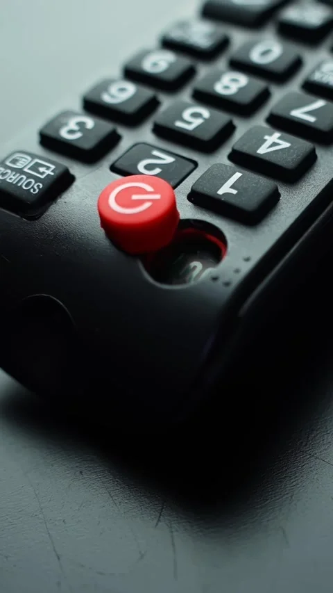 Vertical macro shot of a broken TV remote with a missing button and exposed Stock Footage 331657512