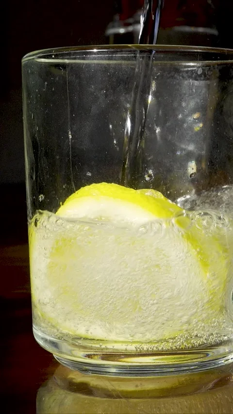 Vertical Macro Sparkling Water with Lemon High Res Slow Motion Stock Footage 331313808