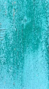 Vertical macro texture of old wood with heavily peeling bright green-turquoise Fotos Stock