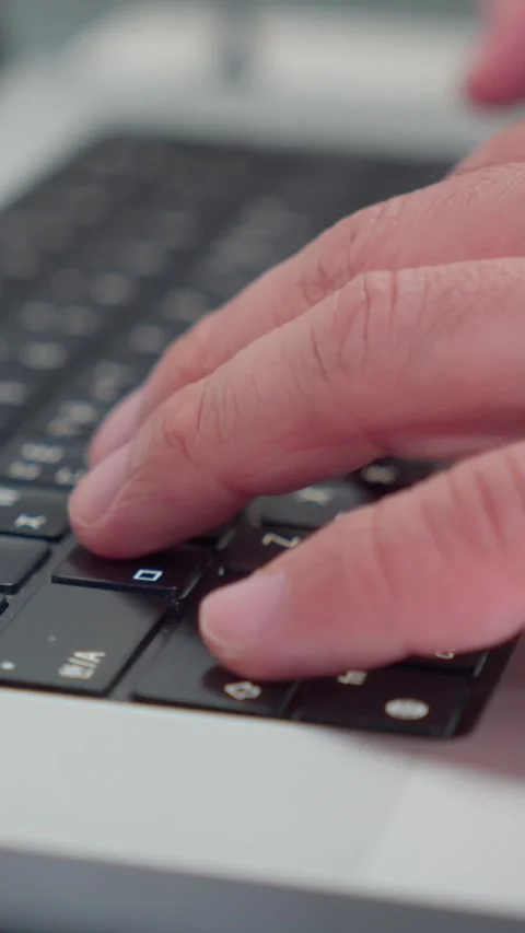 Vertical Macro Of Typing On Laptop Keyboard Close Up 4K Video stock 338368541