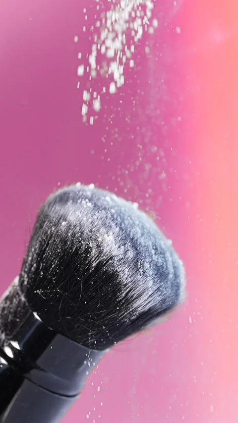 Vertical macro video features a black makeup brush with white rice powder g.. Stock Footage 312466891