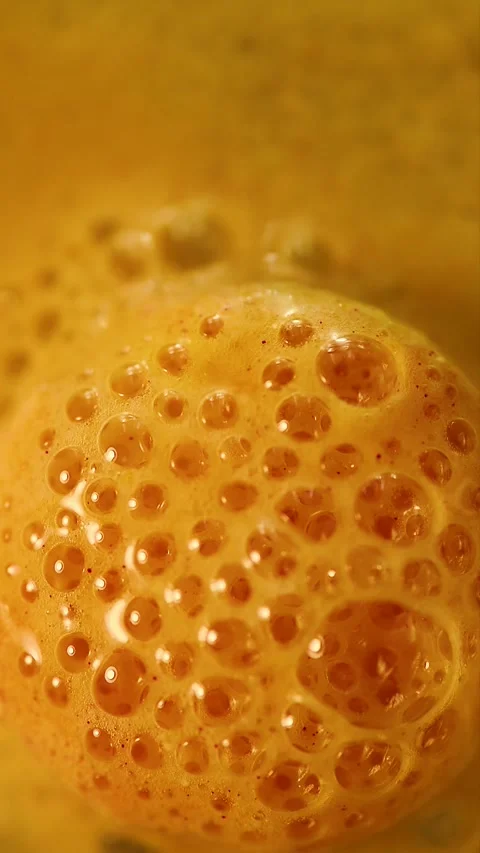 Vertical macro video of fizzing bubbles forming on an effervescent tablet Stock Footage 341825122