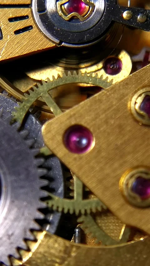 Vertical Macro Video of Mechanical Watch Movement with Ruby Jewels and Cogs Видео 346223266