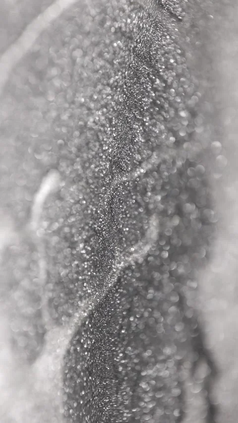 Vertical macro video of silver titanium paint with specialized sandy texture Stock Footage 327605474