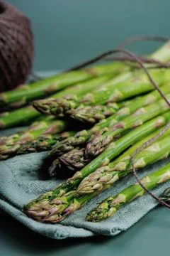 Vertical Macro View of Asparagus Spears on Cloth with Eco Twine Stock Photos
