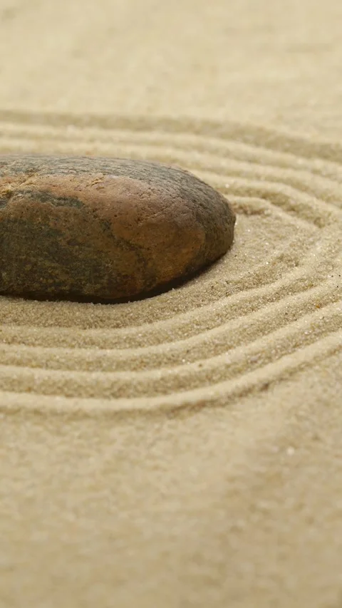 Vertical of making zen garden with sand and stone using mini bamboo wooden rake Video stock 263944273