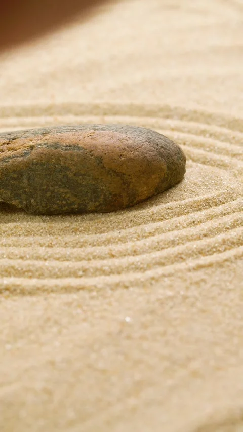 Vertical of making zen garden with sand and stone using mini bamboo wooden rake Stock Footage 274698453
