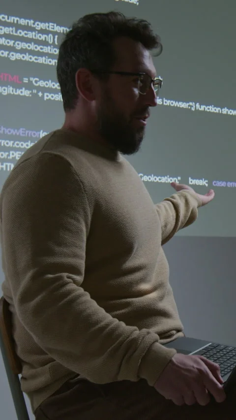 Vertical of Male Coding Teacher Explaining Script Projected on Screen Stock Footage 318728058