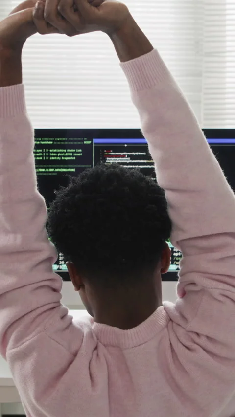 Vertical of Male Developer Stretching Arms while Working on Office Computer Stock Footage 330156685