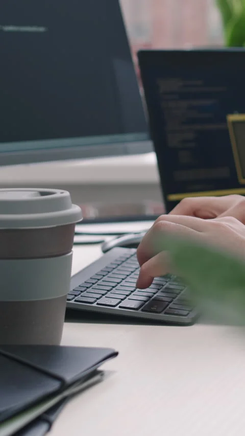 Vertical of Male Programmer Typing Program Code on Desktop Computer in Office Stock Footage 275032273