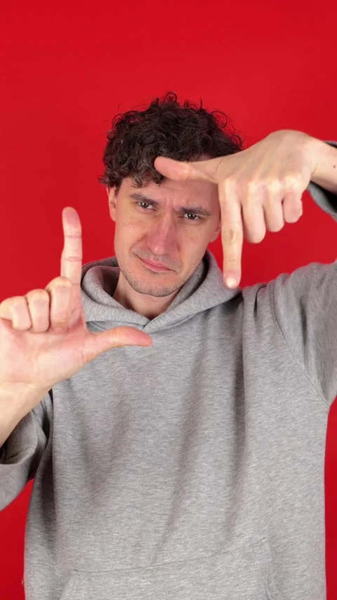 Vertical man making photo frame gesture hands, filled creativity imagination. Видео 304761017
