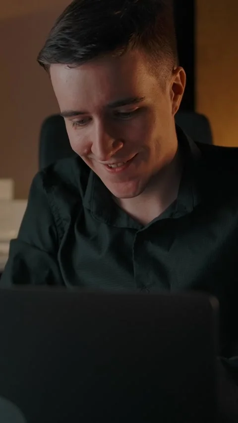 Vertical of The man played the piano and drove up to his laptop to record the Stock Footage 276929128