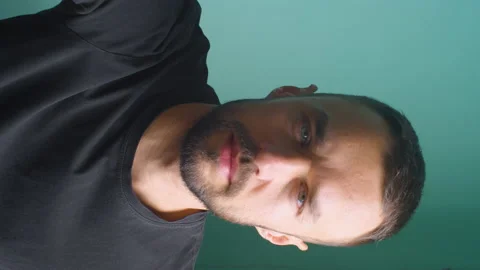 Vertical man preparing camera for video blog. Checking prefrences and thinking Stock Footage 166067923