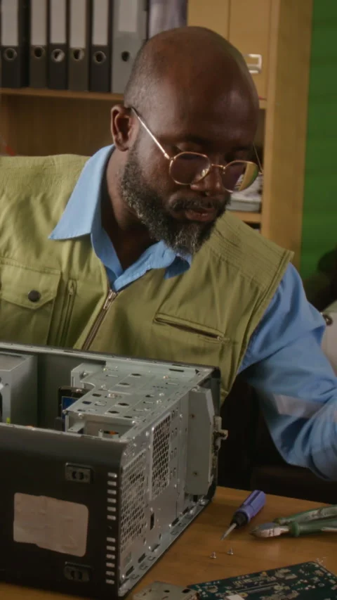 Vertical of Man Repairing Desktop Computer Hardware Stock Footage 341421242