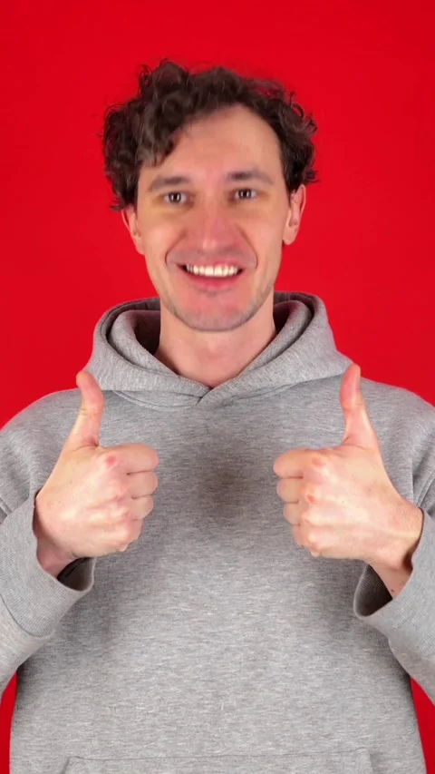 Vertical man showing in front thumb up hand sign like gesture 動画素材 304761309