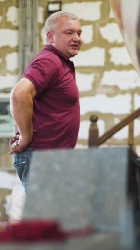 Vertical of Man in spectacles working with homemade sailboat in workroom 4k Stock Footage 305458587