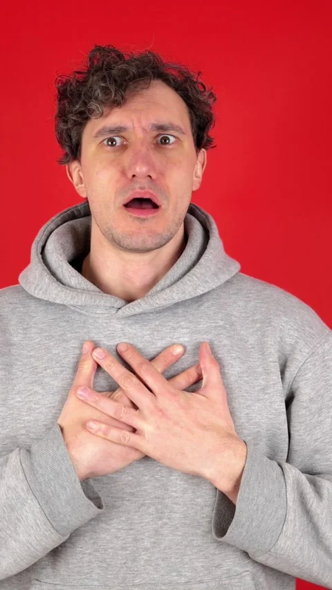 Vertical man suffers asthma attacks, gasps, holds chest hands fear in eyes 動画素材 304760953