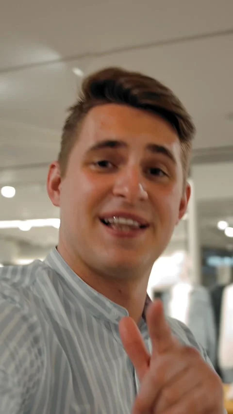 Vertical of A man talking about his shopping in clothes ctore Stock Footage 276932237