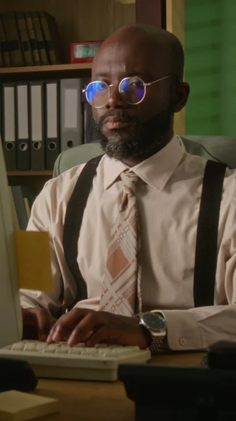 Vertical of Man Typing on Vintage Computer in Retro Office Stock Footage 341418018