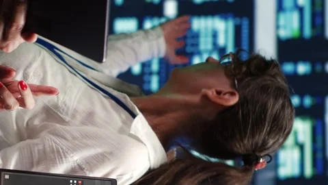 Vertical Managers running code in data center Video stock 248420738