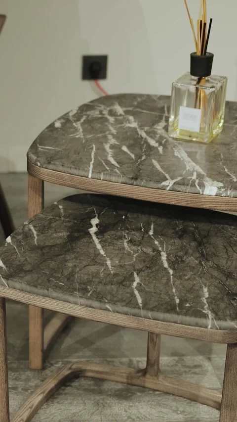 Vertical. Marble bedside table for a modern interior and elegant glass bottles Stock Footage 310238300